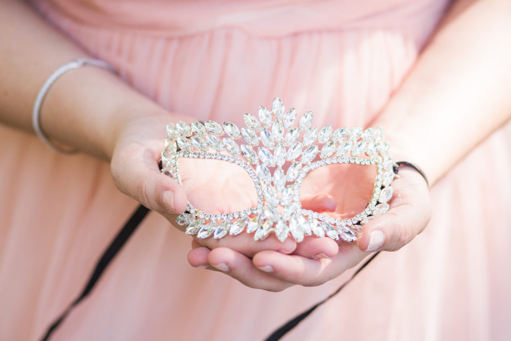 The bride's bejeweled mask